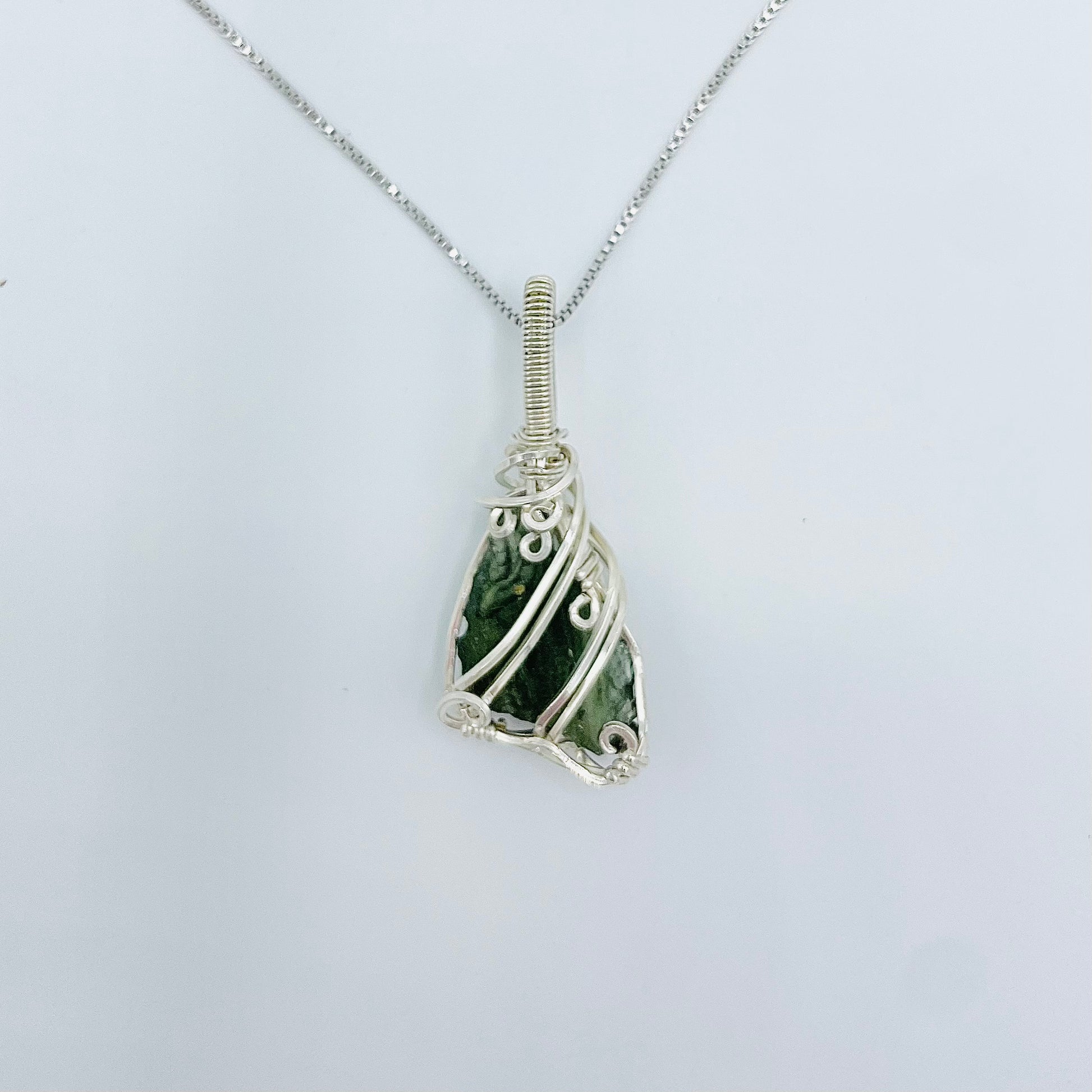 Argentium Silver Wrapped Moldivite on an 18” Rhodium Plated Sterling Silver Box Chain.