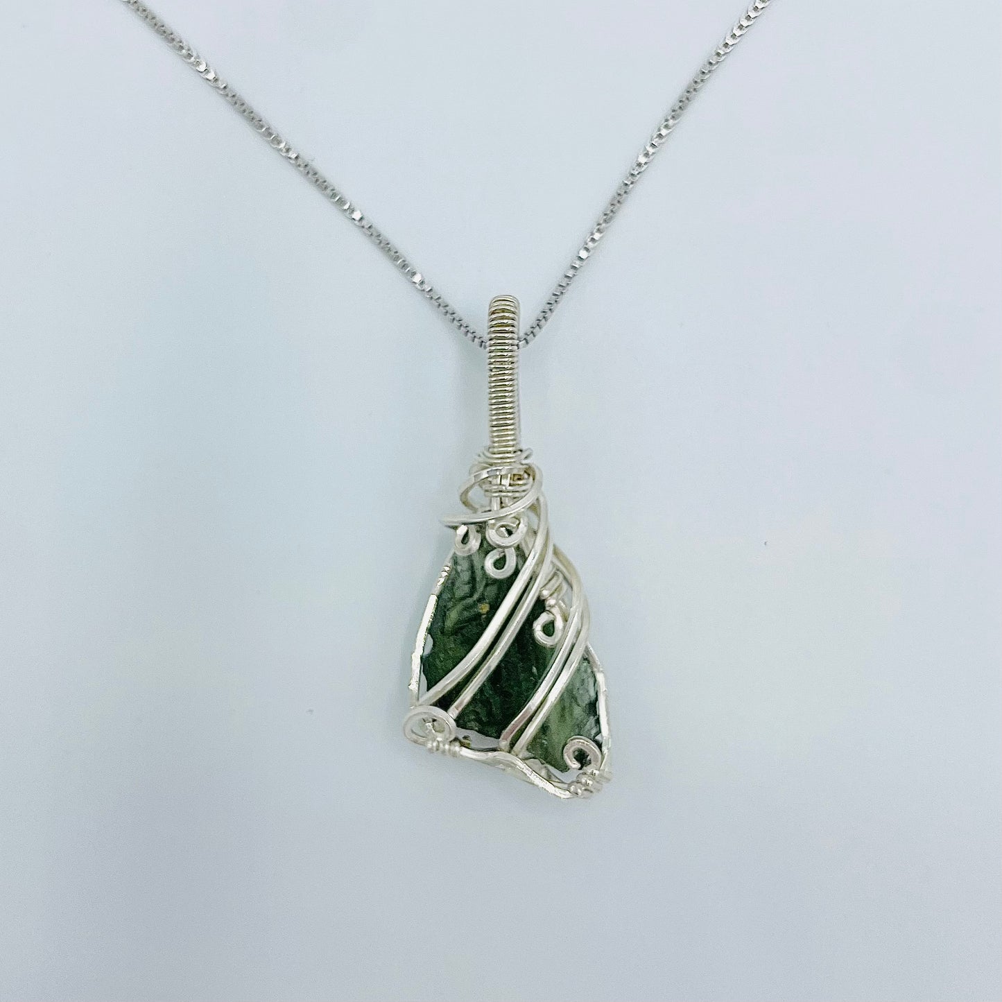 Argentium Silver Wrapped Moldivite on an 18” Rhodium Plated Sterling Silver Box Chain.