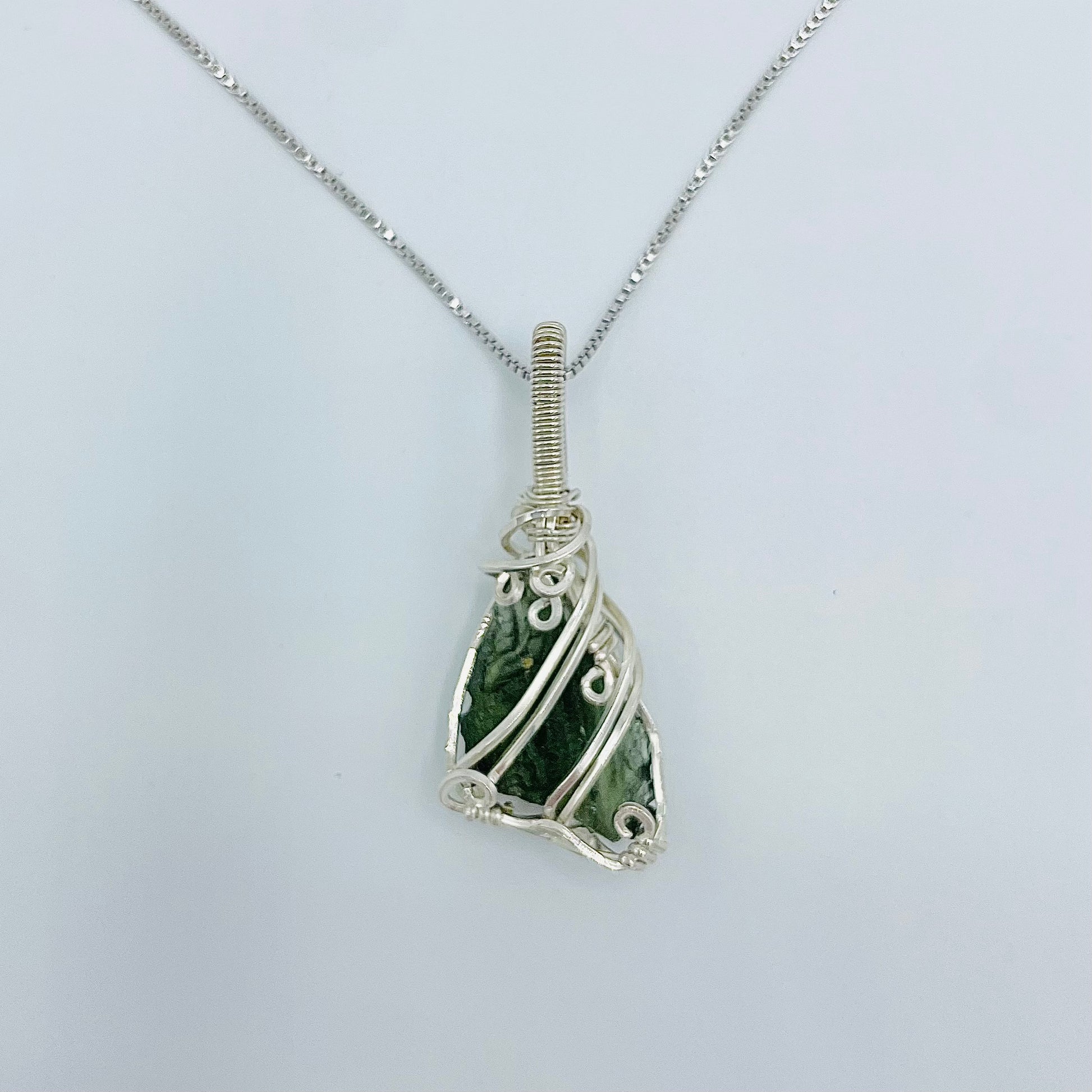 Argentium Silver Wrapped Moldivite on an 18” Rhodium Plated Sterling Silver Box Chain.