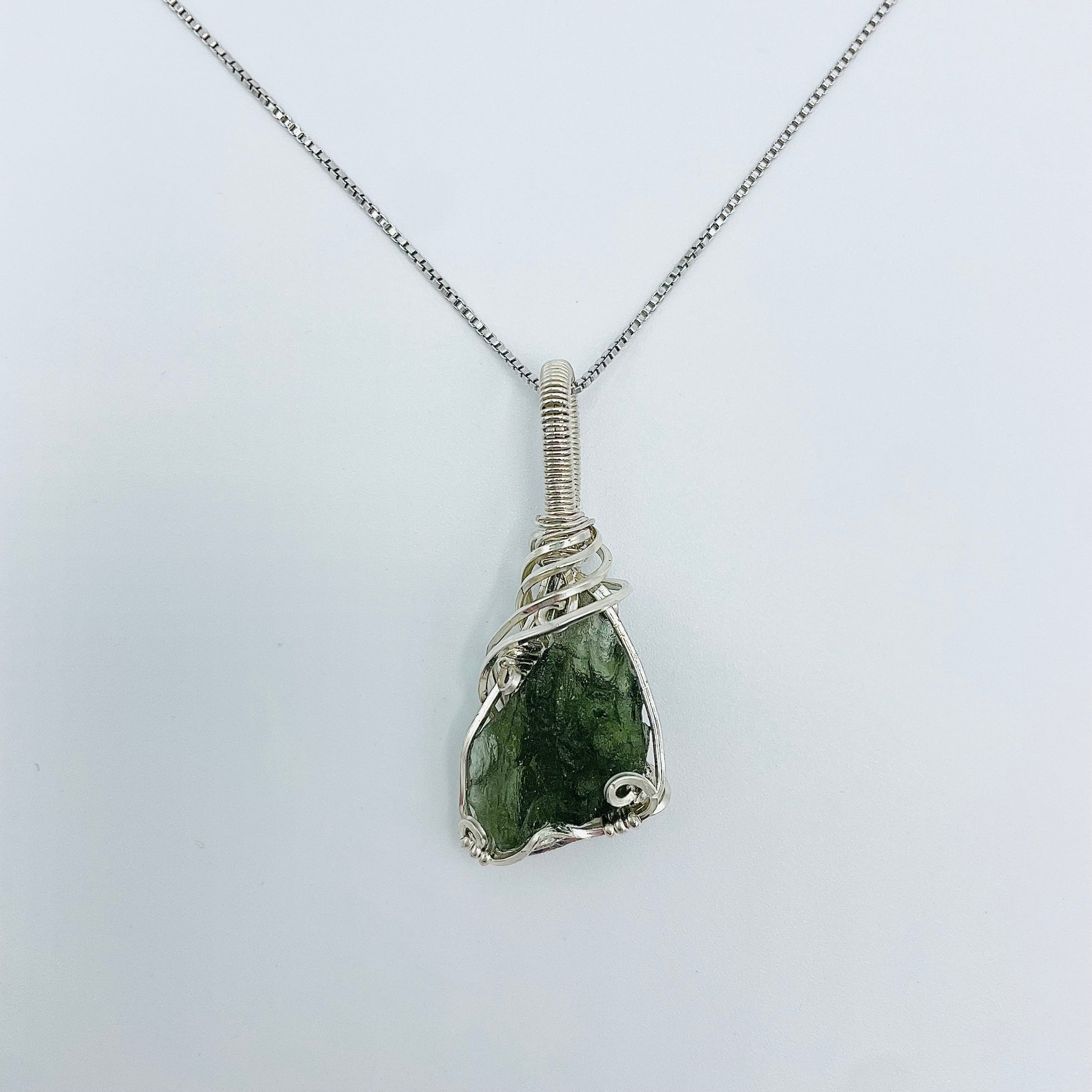 Argentium Silver Wrapped Moldivite on an 18” Rhodium Plated Sterling Silver Box Chain.