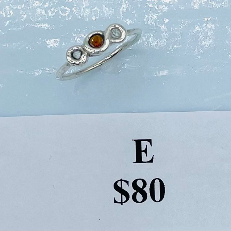 0.20 Total Carat Weight, AA Grade Herkimer Diamonds (18 Natural Facets) sitting on both sides of the 0.20 carat faceted Garnet Argentium Silver Wrapped Ring, Argentium was fused to meet measurements of a standard size 9