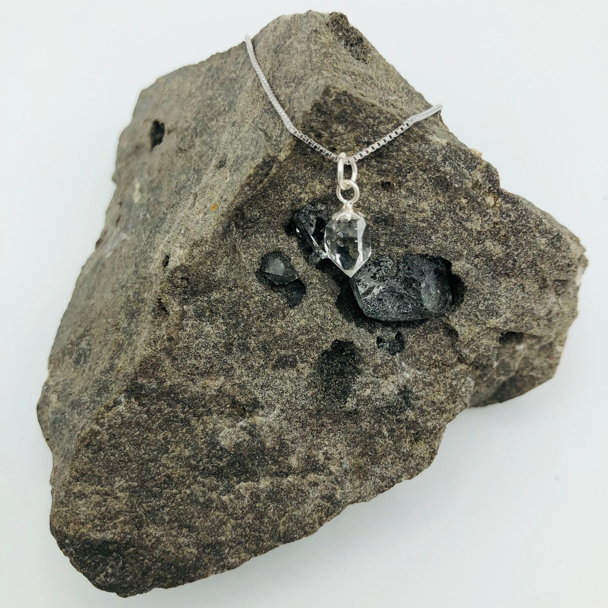 Herkimer Diamond Rhodium Plated Sterling Silver Box Chain on a Herkimer Diamond Specimen (The Herkimer Diamond Specimen is intended to be a prop and is not included in the purchase of the necklace).