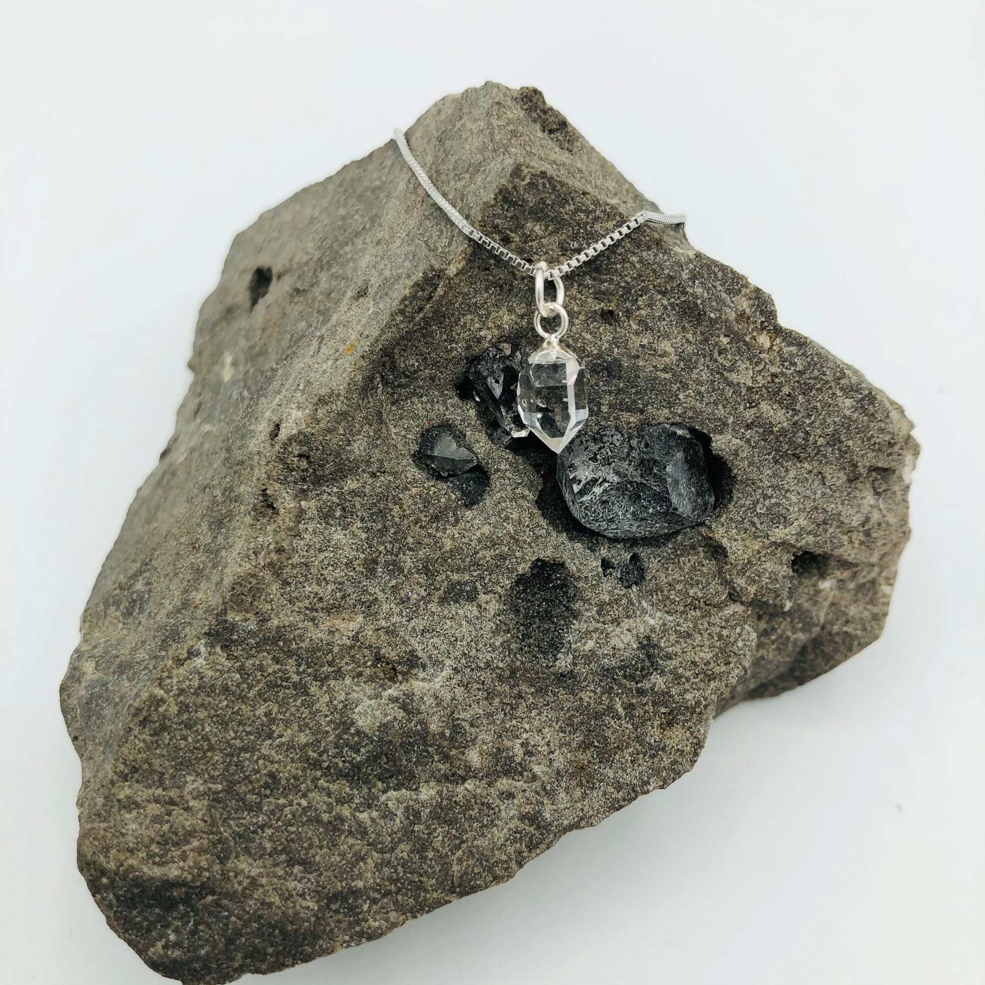 Herkimer Diamond Rhodium Plated Sterling Silver Box Chain on a Herkimer Diamond Specimen (The Herkimer Diamond Specimen is intended to be a prop and is not included in the purchase of the necklace).