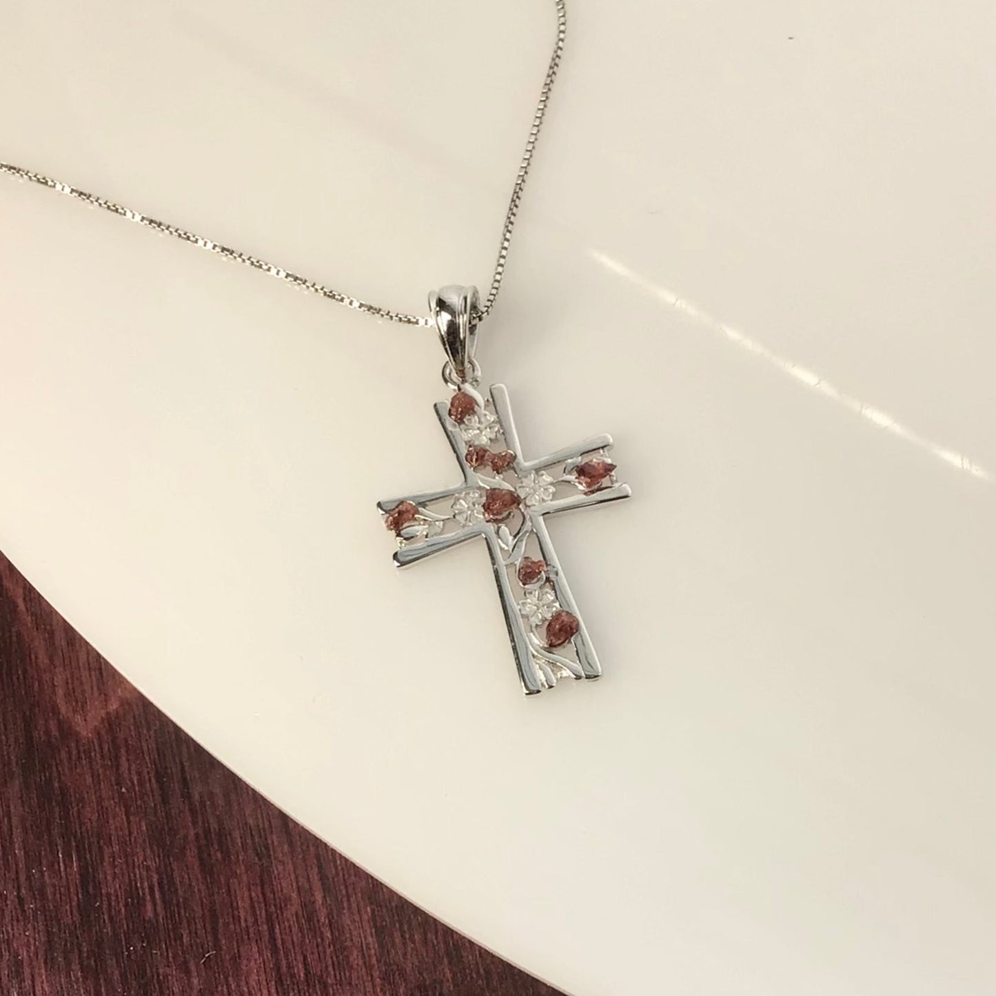 0.25 Total Carat Weight (TCW) Garnet on a Rhodium Plated Sterling Silver Cross & Rhodium Plated Sterling Silver 18” Box Chain