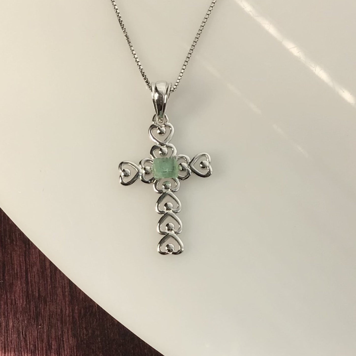 0.40 Carat Green Tourmaline on a Rhodium Plated Sterling Silver Cross and Rhodium Plated Sterling Silver 18” Box Chain.