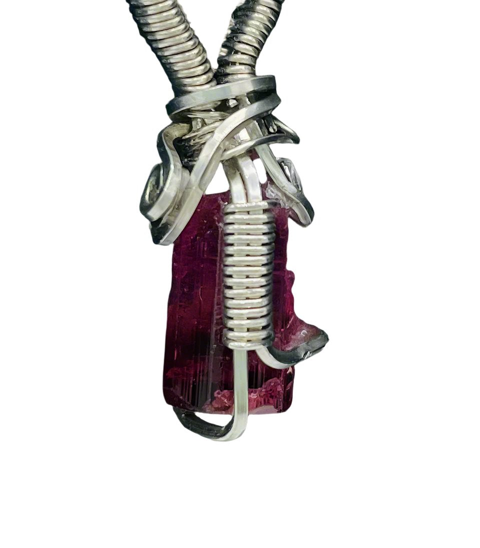 Side view of Bi-Color Pink Tourmaline, wrapped in Argentium Silver, on an 18” Rhodium Plated, Sterling Silver Box Chain