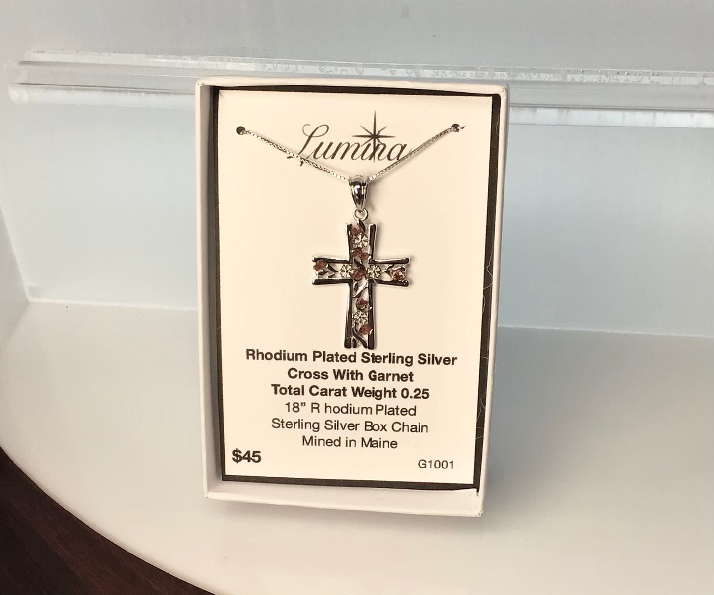 0.25 Total Carat Weight (TCW) Garnet on a Rhodium Plated Sterling Silver Cross & Rhodium Plated Sterling Silver 18” Box Chain