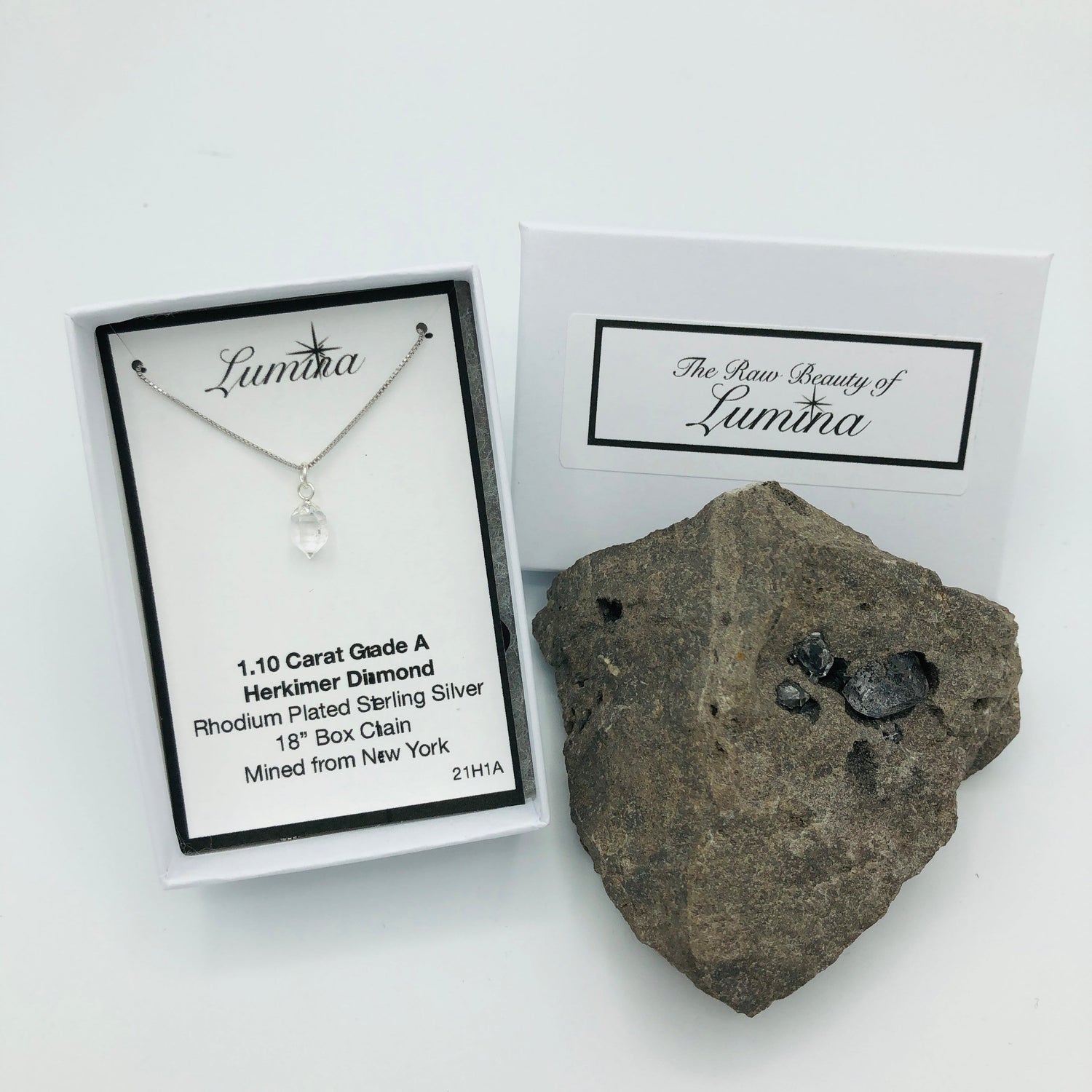 Herkimer Diamond on an 18 in Rhodium Plated Sterling Silver Box chain displayed nicely in a box next to a Herkimer Diamond Specimen