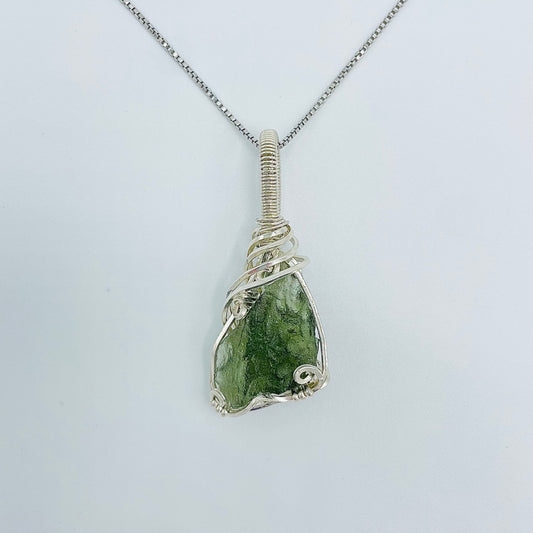 Argentium Silver Wrapped Moldivite on an 18” Rhodium Plated Sterling Silver Box Chain.