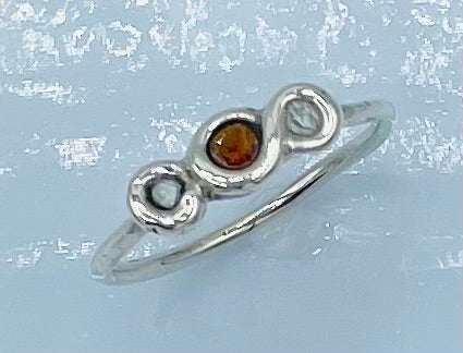 0.20 Total Carat Weight, AA Grade Herkimer Diamonds (18 Natural  Facets) sitting on both sides of the 0.20 carat faceted Garnet  Argentium Silver Wrapped Ring, Argentium was fused to meet measurements of a standard size 9