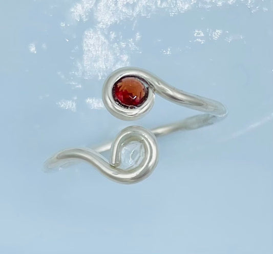 Argentium silver with A faceted Garnet on one side