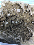 This Unique Business card holder is perfect for the office, home business or for that special someone.   This business card holder contains a micro Herkimer Diamond, Druzy and Calcite Crystals in a Dolomite Matrix.  This piece was mined in Herkimer New York.  Formed over 500 millions years ago this is a one of a kind gift that cannot be duplicated.  Business Card Gap is 1cm