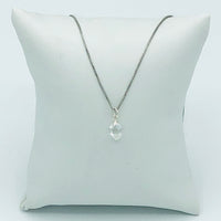 Herkimer Diamond Rhodium Plated Sterling Silver Box Chain on a jewelry pillow. (The Jewelry pillow is intended to be a prop and is not included in the purchase of the necklace. )